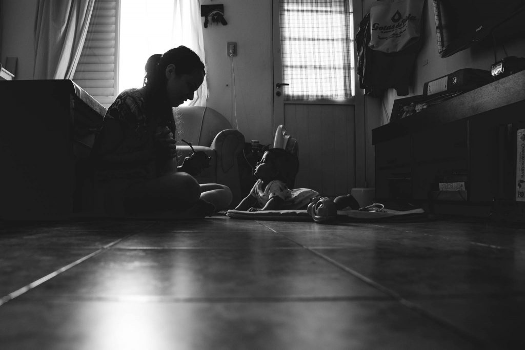 Mom having breakfast in the floor with her baby