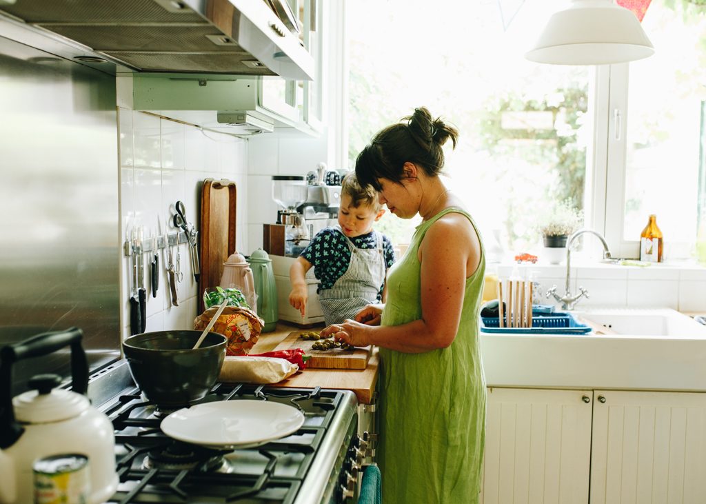 cooking with your toddler on the countertop trying to make things peacefully