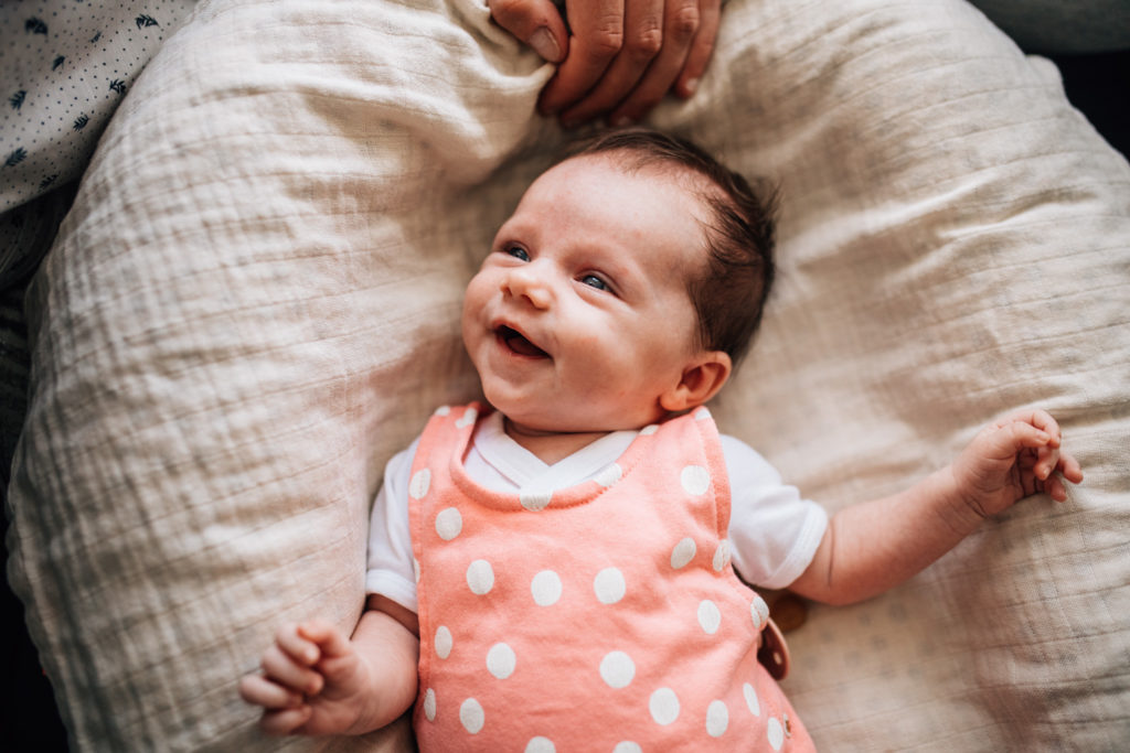 5 weeks old baby girl smiling to her dad