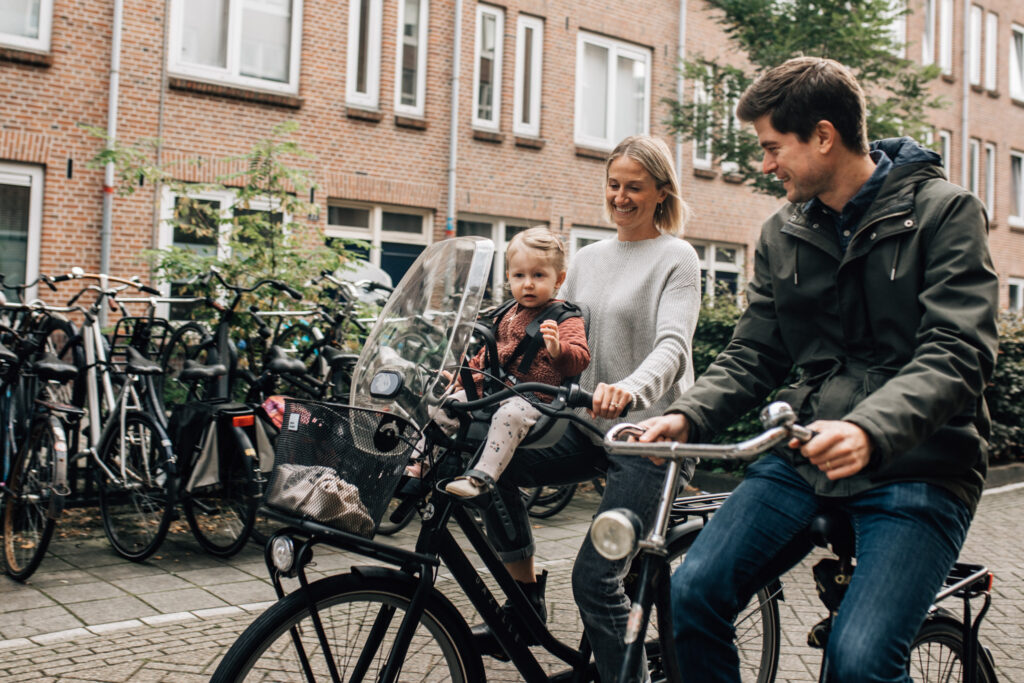 Family biking in the streets of Amsterdam.