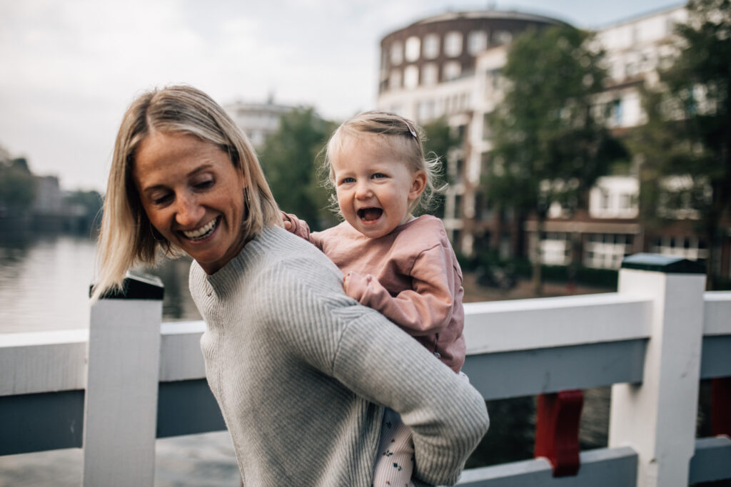 Mother and daughter playing on a bridge in Amsterdam West.